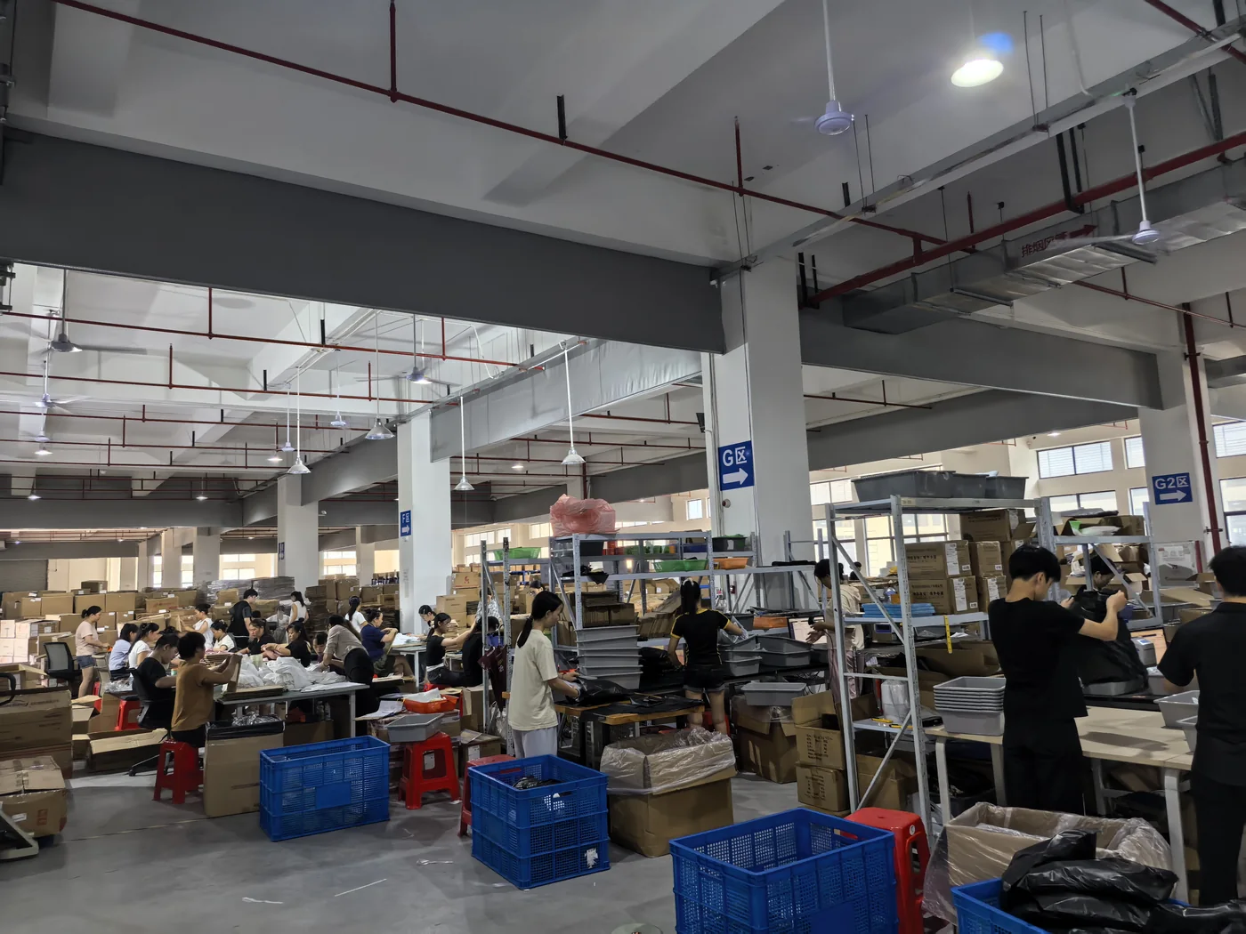 Staff handling goods in the fulfillment work area