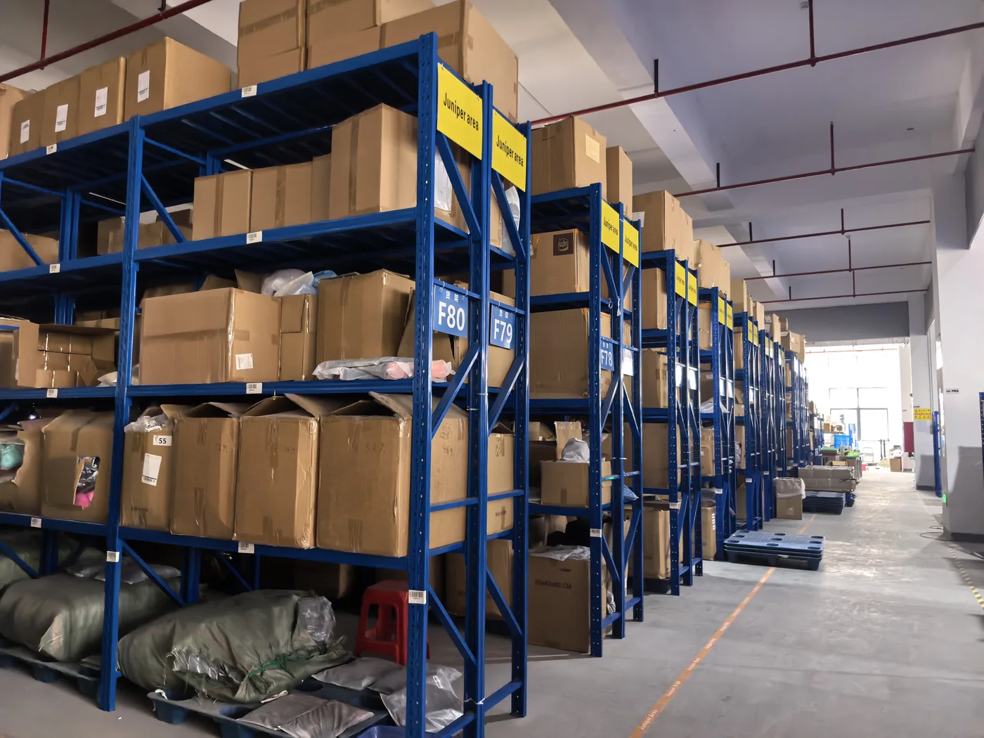 Warehouse rack aisle with boxed inventory