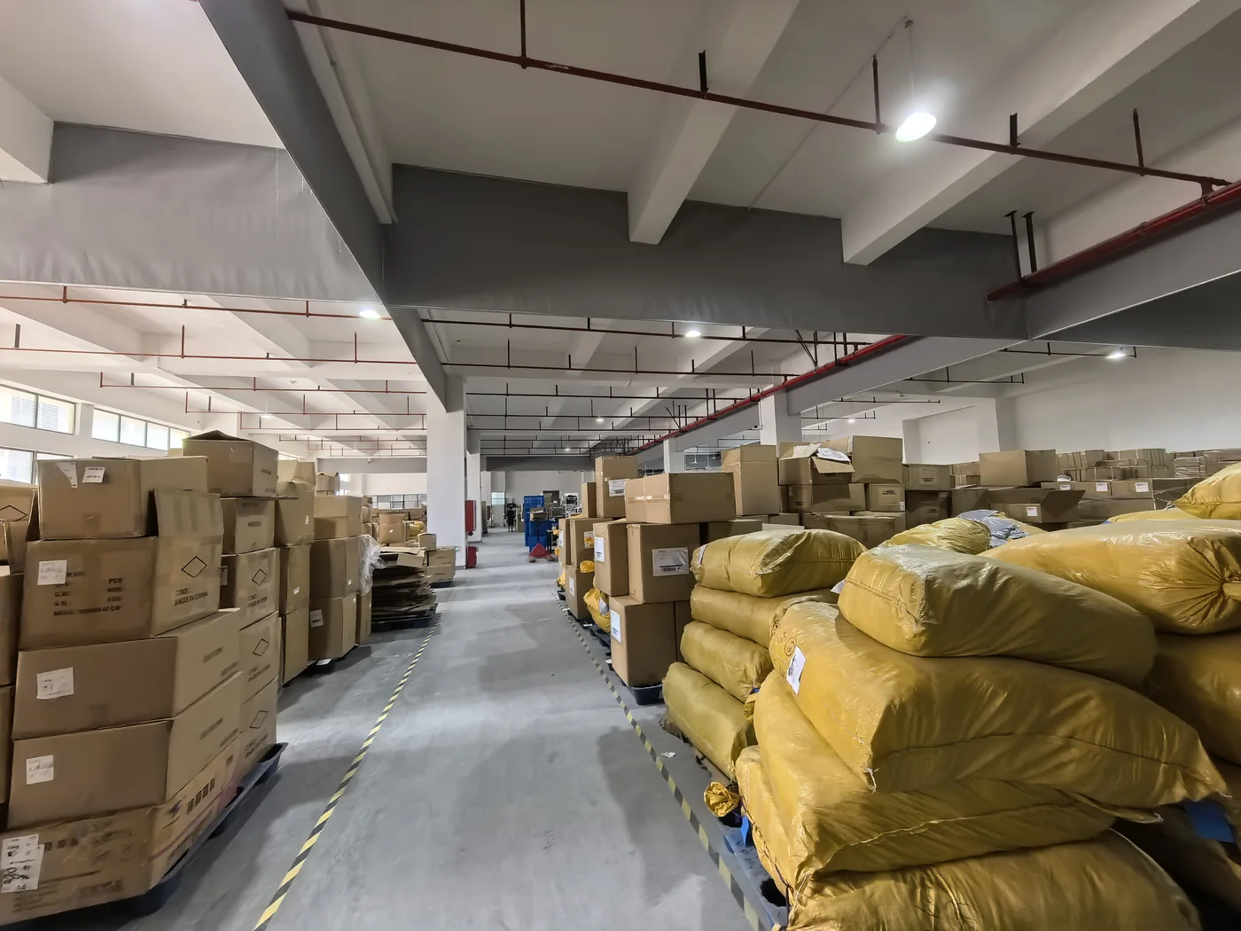 Warehouse corridor and stored cartons and bags